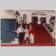 Chester and Agnes Sakura posing with man in doorman's uniform (ddr-densho-523-377)