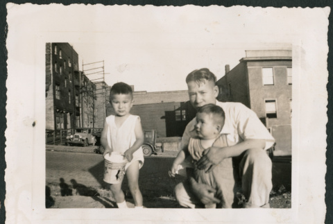 Photo of a man with two children (ddr-densho-483-796)