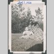 Woman and baby sitting on lawn (ddr-densho-483-581)