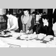 Japanese Americans sorting mail (ddr-densho-37-113)