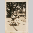 Two boys on one swing (ddr-densho-430-308)