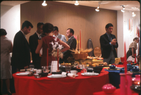 Group standing by display of table setting (ddr-densho-426-375)