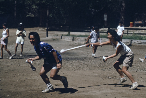 Paul Osaki and Courtney Goto during a water balloon fight (ddr-densho-336-1585)