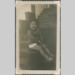 Girl sitting on stairs (ddr-densho-321-1053)