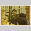 Henri Takahashi seated at a table (ddr-densho-426-158)