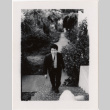 Norman Takahashi on stairs (ddr-densho-426-218)