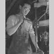 Machinist operating drill press in motor pool shop at Heart Mountain incarceration camp (ddr-csujad-14-57)