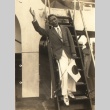 A man waving and holding Japanese flag (ddr-njpa-4-129)