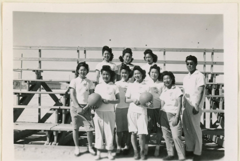 Girl's basketball team standing (ddr-densho-37-1070)