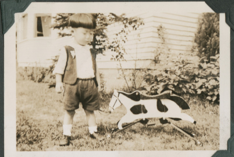 Boy with toy horse (ddr-densho-355-480)
