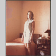 Woman standing in bedroom (ddr-densho-523-469)