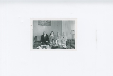 (Photograph) - Image of man and women sitting on couch (ddr-densho-330-280-master-cf45798fb9)