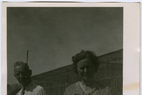 Man and woman by building (ddr-densho-329-739)