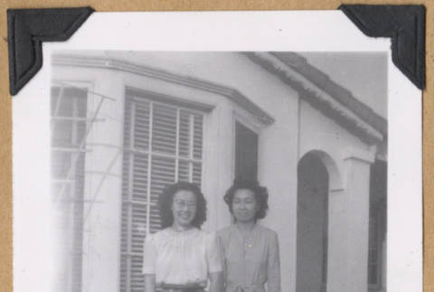 Women and boys pose on a lawn (ddr-densho-542-315)
