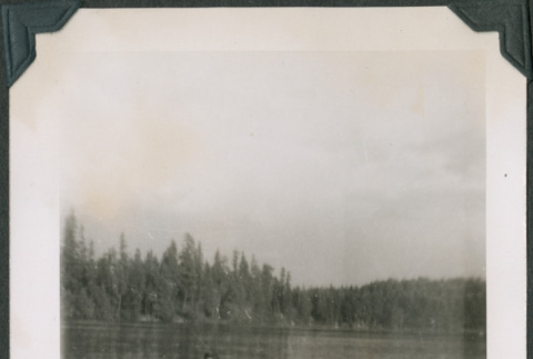 Photo of four people in a row boat (ddr-densho-483-1254)