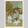 Woman with three small children by Christmas tree (ddr-densho-430-194)
