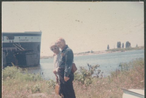 Agnes and Chester Sakura standing on shore by ship (ddr-densho-523-453)