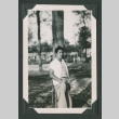Man leaning against a tree (ddr-densho-471-72)