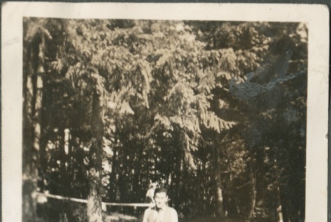 A man standing in a wooded area (ddr-densho-316-57)