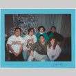 Christmas card with 6 people in front of a Christmas tree (ddr-densho-430-269)