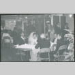 Bride and groom at table with guests (ddr-densho-523-354)