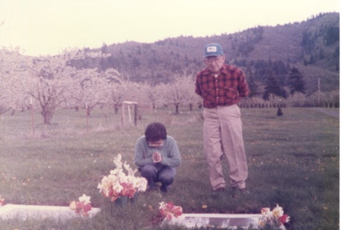 George Kida at family gravestones (ddr-one-3-96)