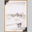 Mitzi seated at a concentration camp (ddr-densho-542-266)
