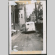 School bus in dirt alleyway (ddr-densho-483-1014)
