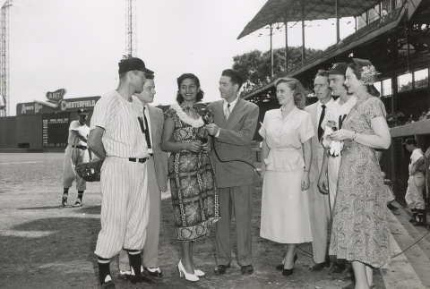 Miss Hawaii being interviewed on a baseball field (ddr-njpa-2-835)