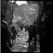 People walking on stone path (ddr-densho-426-289)