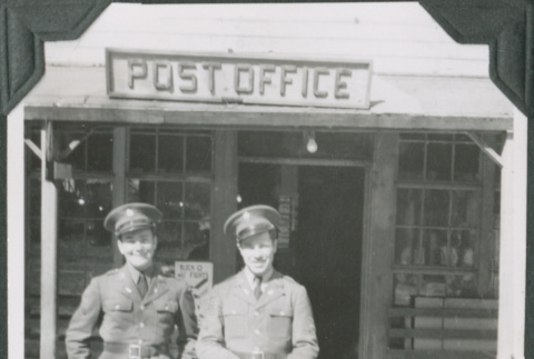 Two men standing outside post office (ddr-ajah-2-350)