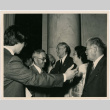 Group of people greeting, likely at a reception of event related to redress and creation of CWRIC (ddr-densho-393-11)