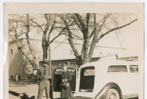 Henrietta Schoen and uniformed man in front of an ambulance (ddr-densho-223-1)