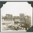 View across river with rubble in foreground (ddr-ajah-2-711)