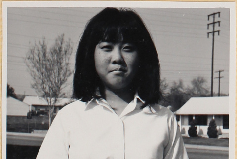 Girl holding flower (ddr-densho-522-125)