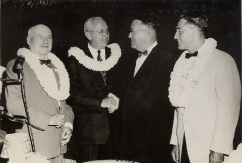 Ingram Stainback, Farrant L. Turner, Lawrence M. Judd, and Neal Blaisdell wearing leis (ddr-njpa-2-987)