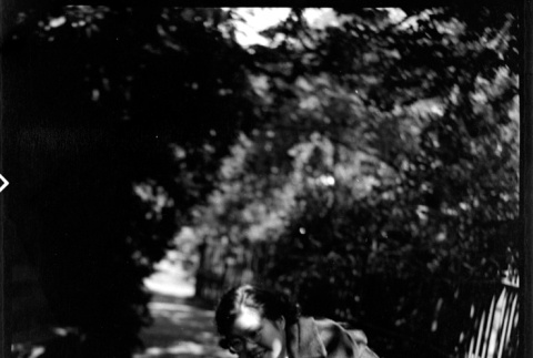 Tomoye (Nozawa) Takahashi feeding a squirrel (ddr-densho-426-1906)