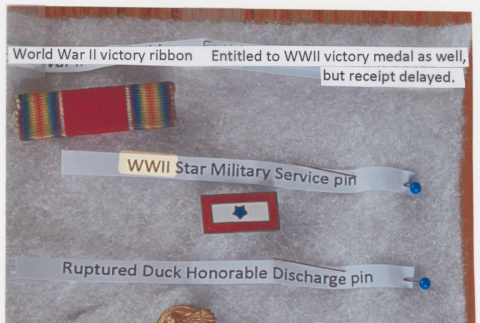 WWII Victory ribbon, Service pin and discharge pin (ddr-densho-539-129)