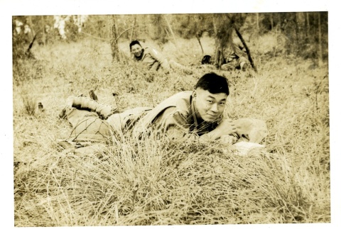 Soldiers relaxing in a field (ddr-densho-22-231)