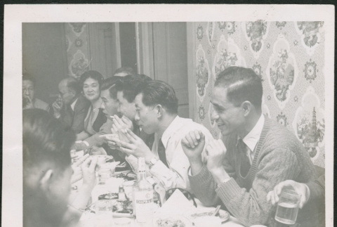 Group of men and women around table (ddr-densho-293-164)