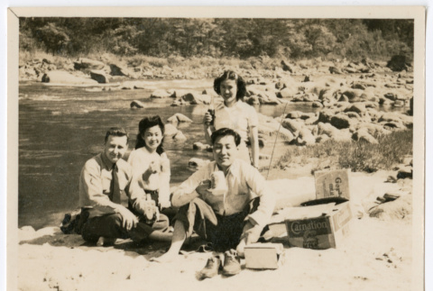 Mitsuye Takemiya and Charles Roeslin Jr. with others at beach (ddr-densho-550-39)