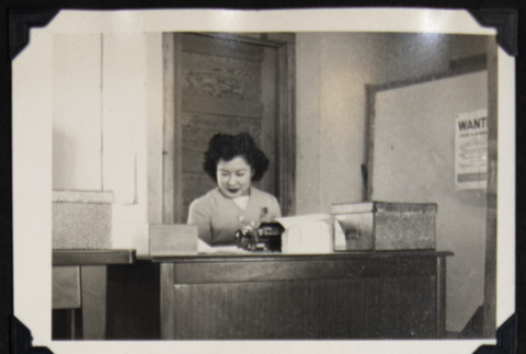 Nori behind a desk (ddr-densho-542-691)