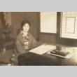 Woman seated a desk with calligraphy (ddr-njpa-4-1624)
