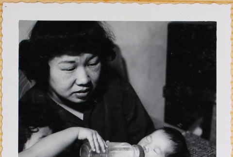Leslie Shiomi being bottle fed (ddr-densho-522-344)