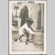 Toddler playing with box (ddr-densho-483-672)