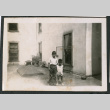 Photo of two children on a roof (ddr-densho-483-807)