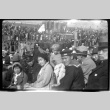 Family in stands at Kezar stadium with large crowd (ddr-densho-426-1574)