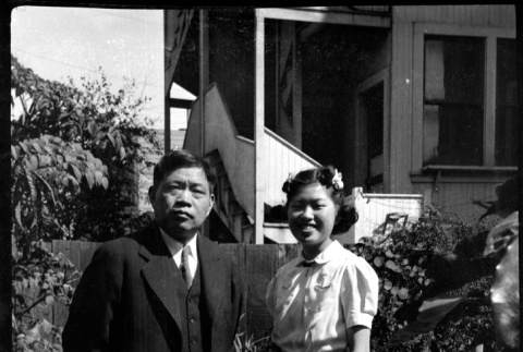 Tomoyuki Nozawa and Martha (Nozawa) Tsuchida Suzuki standing in garden (ddr-densho-426-2185)
