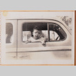 Photo of a baby in a car window (ddr-densho-483-489)