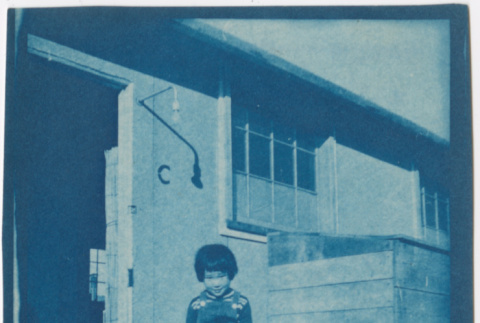 Two children outside barracks (ddr-densho-329-1282)